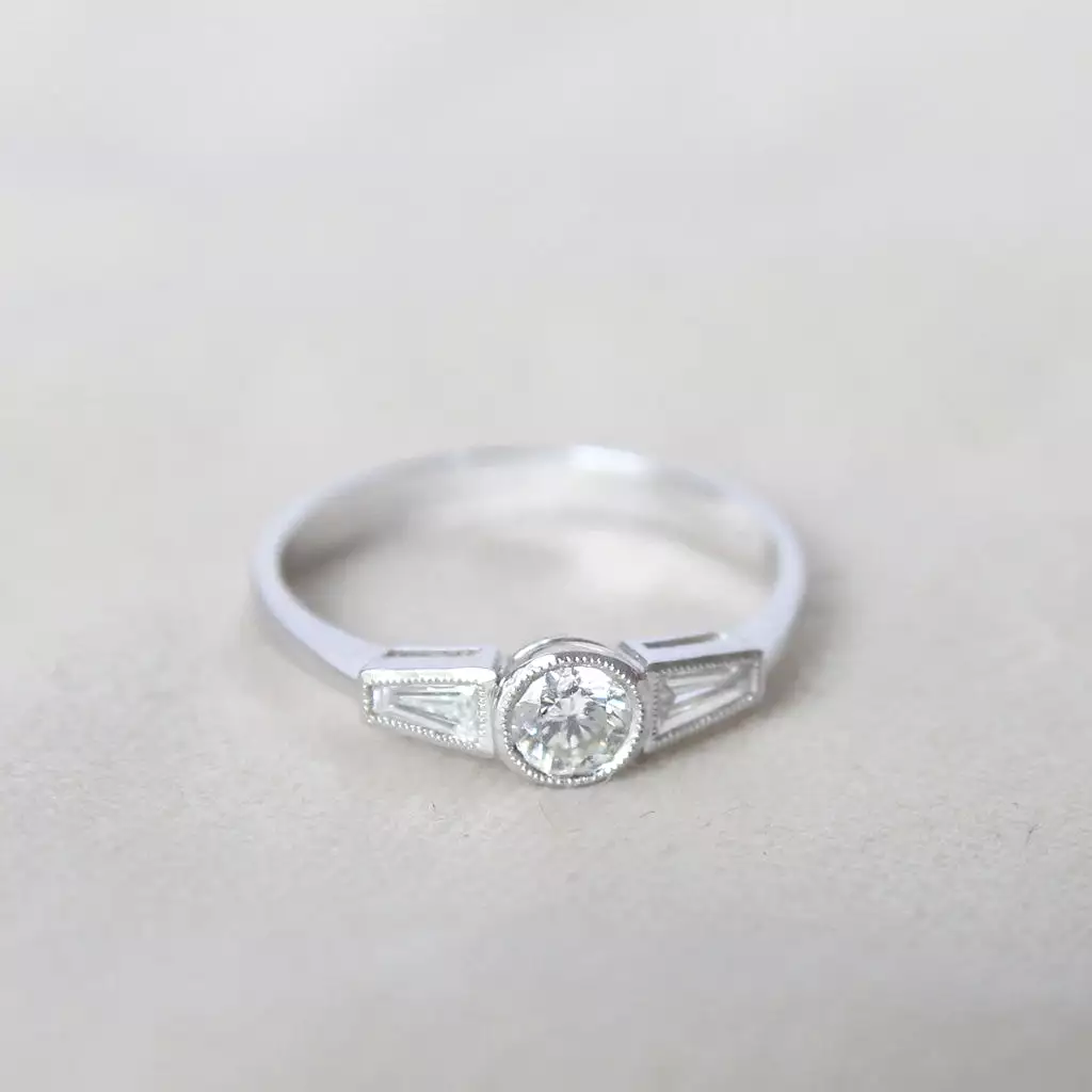 Art Deco Style 0.60 Carat Brilliant and Baguette Cut Diamond Ring